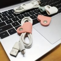 a0e97a7b-f49d-4525-ac09-fc9e77c077eb.jpg Heart-Shaped PU Cable Organizer Button Set for Data Cables & Earphones – 3 Pieces
